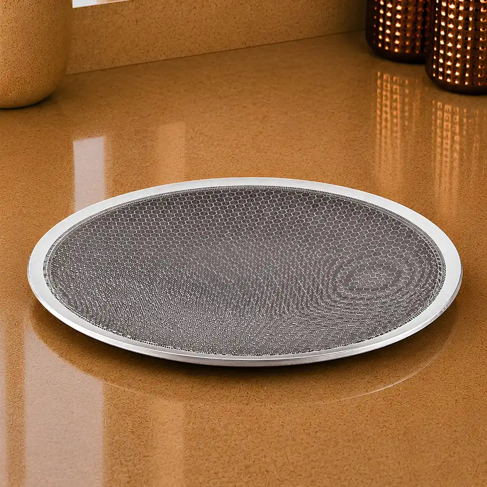 Round gray mat with textured surface on a brown surface