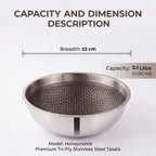 Tri-Ply stainless steel tasla with a honeycomb cooking surface and sturdy side handles, displayed on a dark brown background. Heavy-duty deep cooking vessel suitable for gas and induction cooktops.