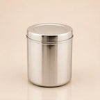 A shiny stainless steel cylindrical canister with a matching screw-on lid, shown on a plain beige background.