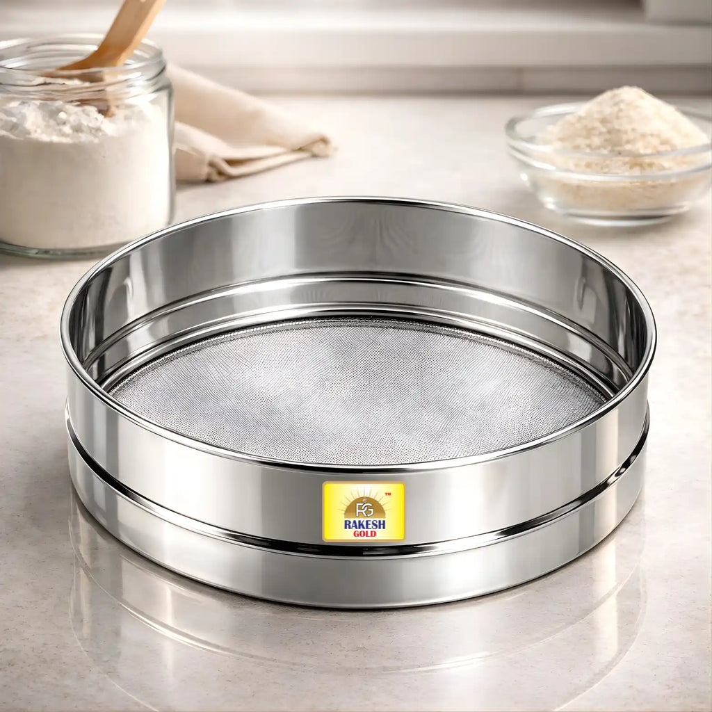 Stainless steel fine mesh chalni (flour sieve) on a modern kitchen countertop, ideal for sifting atta, maida, besan, powdered sugar, and spices.