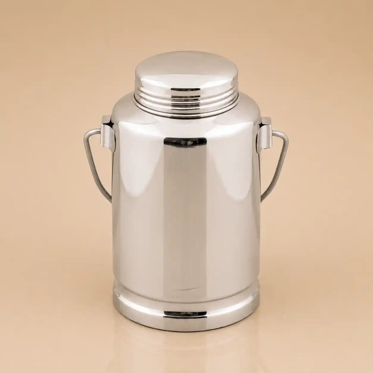 A polished stainless steel milk canister with a matching screw-top lid and two side handles, shown on a plain beige background.