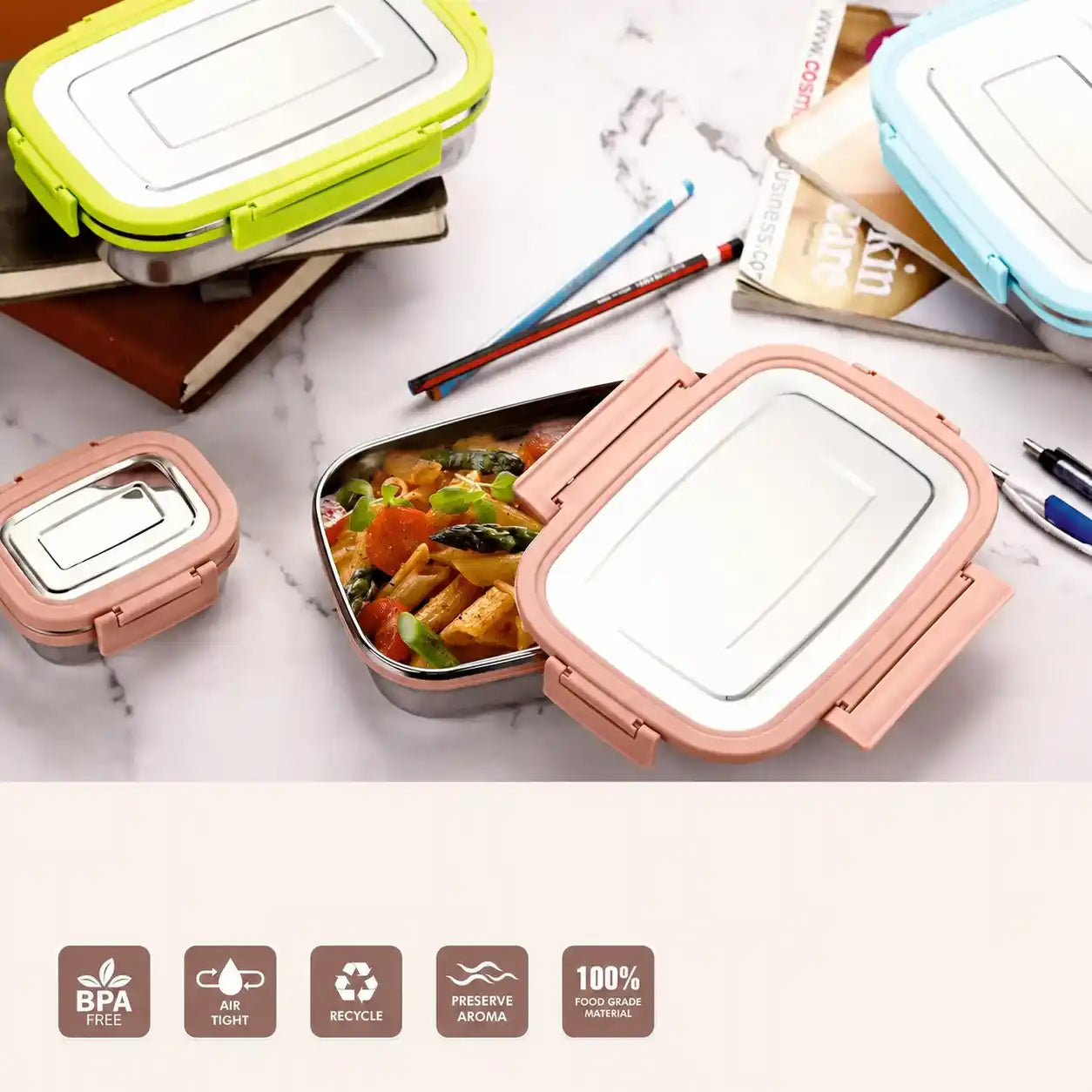 Colorful bento boxes with food on a marble surface, featuring BPA-free and eco-friendly icons.