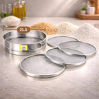 4-in-1 stainless steel chalni (flour sieve) set with interchangeable mesh screens on a modern kitchen countertop, ideal for sifting flour, atta, maida, and grains.