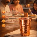 Hammered copper drinking glass placed on marble kitchen countertop