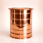 Polished copper water storage container with lid isolated on light background