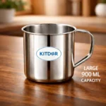 Stainless Steel Mug with Handle filled with ice water on wooden table in kitchen